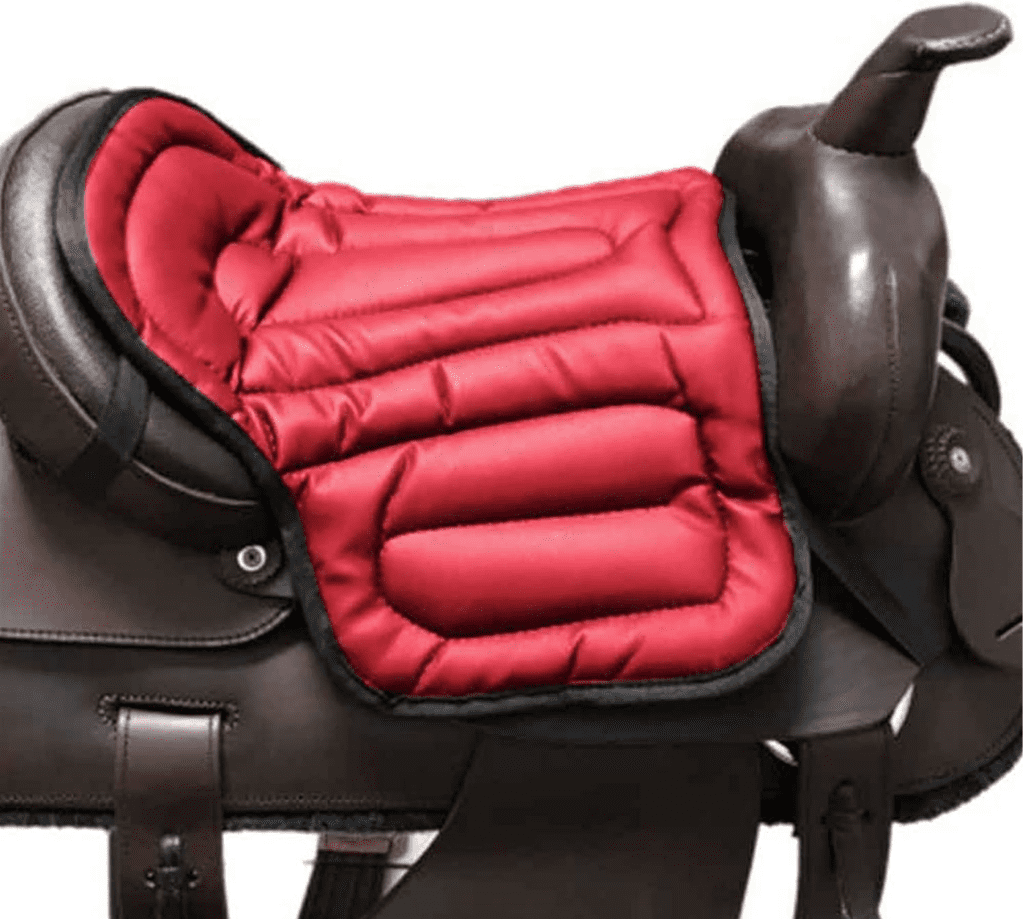 Western saddle cushion on horseback rider - Comfortable gel seat saver for trail riding, shock absorption, and improved riding posture.