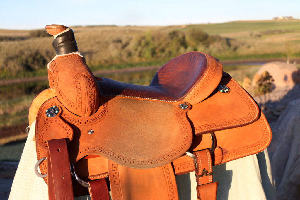 Classic leather wade saddle with distinctive wood post horn and slick fork design.
